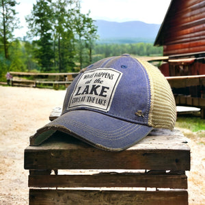 "What Happens at the Lake Stays at the Lake" Distressed Trucker Hat